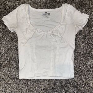 Hollister white top with bow, size XXS, never worn
